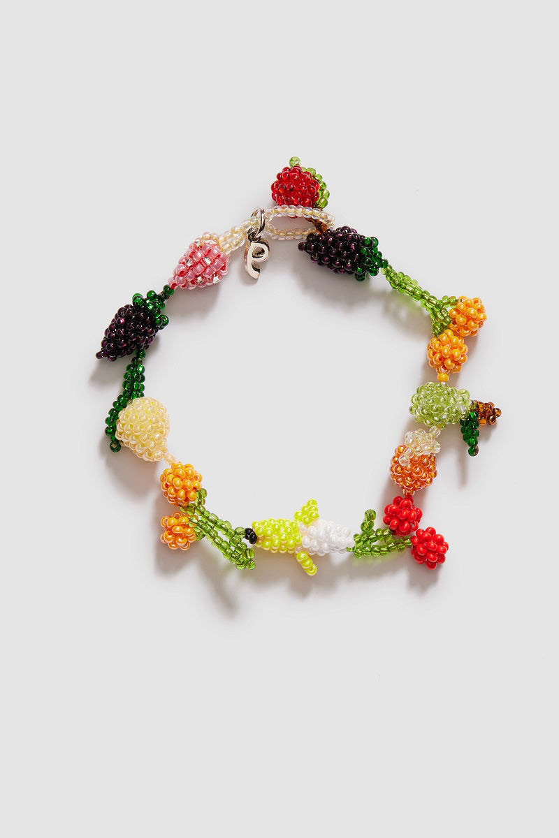 Colorful Fruit Salad Galore bracelet by Pura Utz featuring vibrant, fruit-inspired charms on a stretch band.