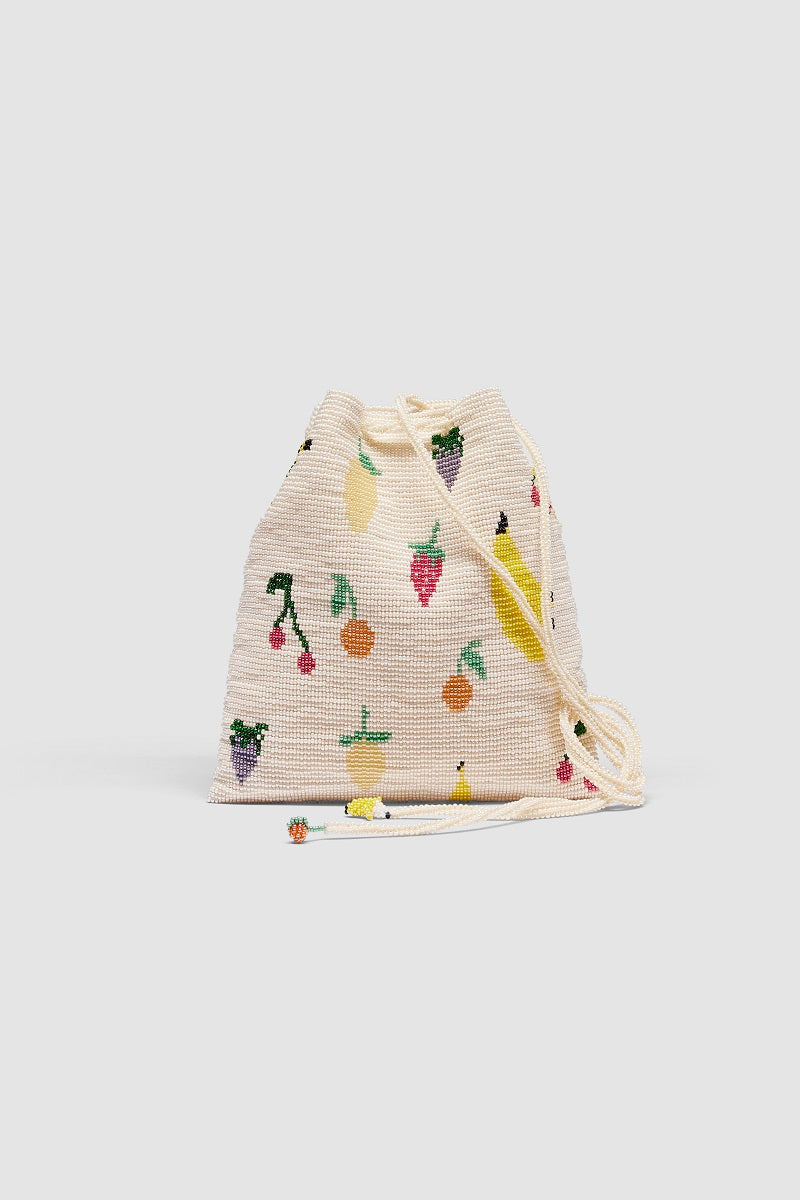 Beige Pura Utz Fruit Salad Pouch shoulder bag with a vibrant fruit pattern and adjustable strap.