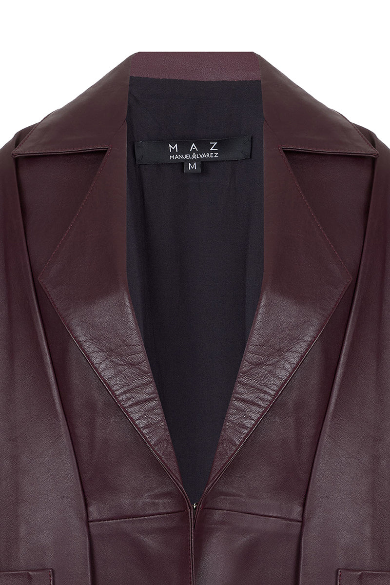 Maz Manuela Álvarez Furrows leather blazer in wine red, shown on a hanger with a tailored fit and smooth leather texture.