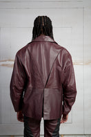 Wine red leather blazer by MAZ Manuela Álvarez, tailored fit with lapel collar and front buttons, stylish for sophisticated looks.