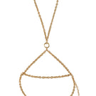 Gold Cassidy body chain by Silvia Gnecchi, stylish body jewelry with intricate design, worn on the torso.