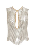 Silver and gold chain vest by Silvia Gnecchi, layered over a top, featuring intricate chain details and a modern, stylish design.