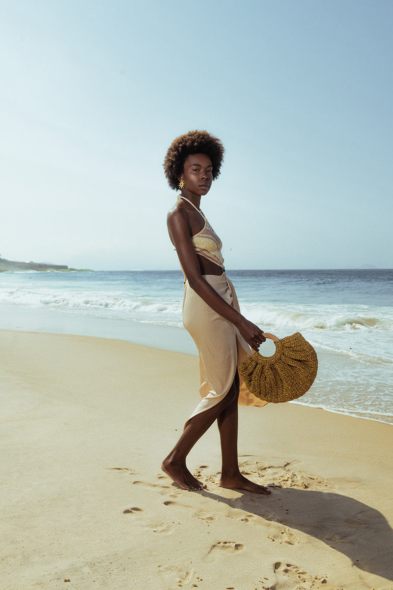 Mara Brazil Gaia Bag top handle bag in natural leather with sleek design and sturdy handles.