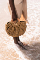 Mara Brazil Gaia bag, a stylish top handle bag with a sleek design, shown in a neutral color with a structured shape.