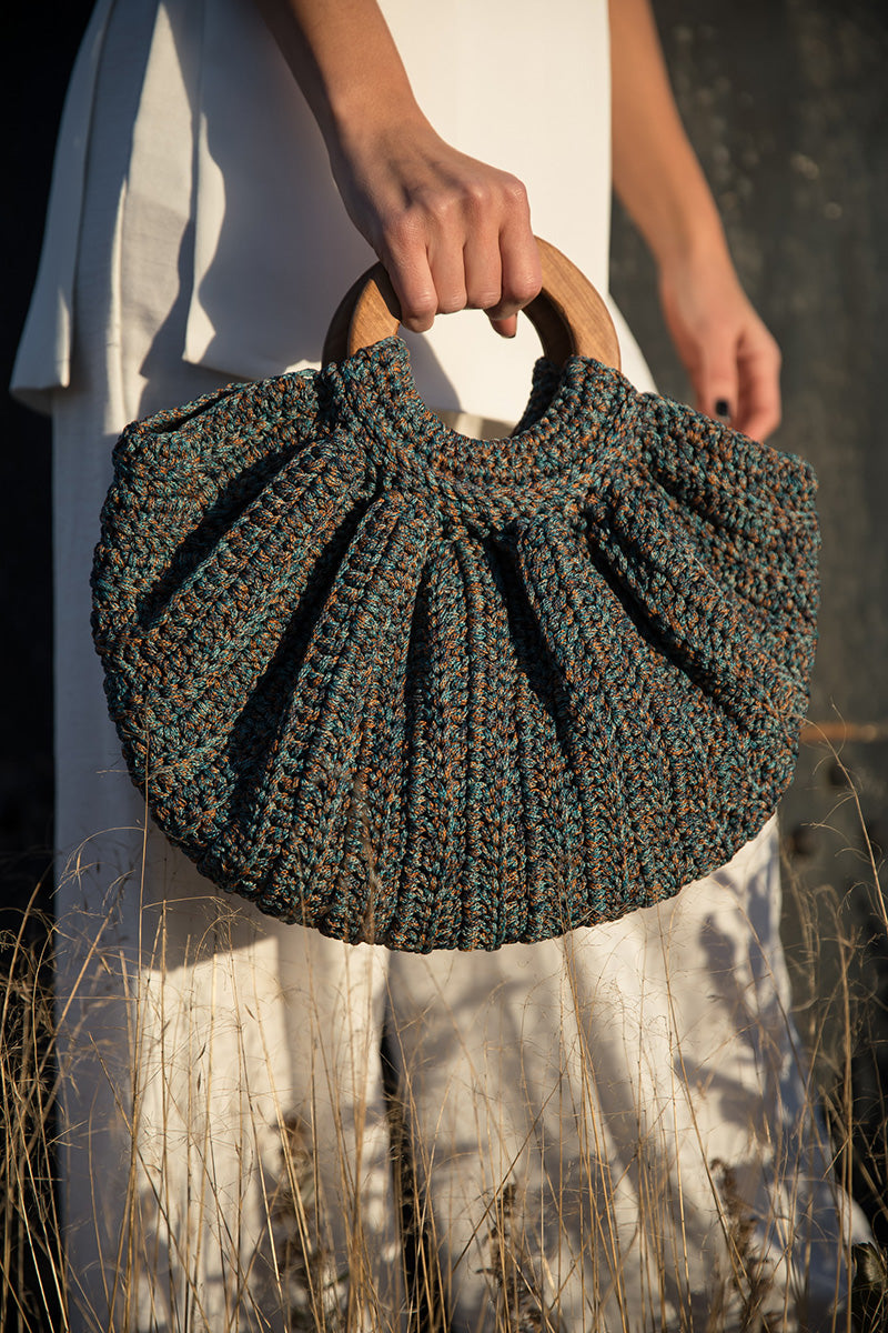 Mara Brazil Gaia Bag, a stylish top handle bag with a structured design, featuring natural leather and elegant craftsmanship.