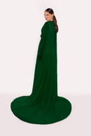 Emerald green gown by Tarık Ediz featuring elegant design and flowing fabric, perfect for formal occasions.
