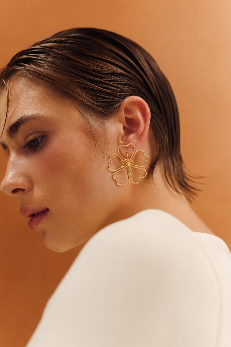 Sara & Flora Aurora Midi Contour Earrings showcasing sleek, metallic earrings with a modern design on a white background.