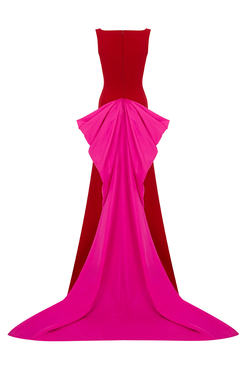Red GRANATO gown by MOON / HAKAAN YILDIRIM featuring elegant fabric and a flowing silhouette.