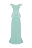 Light mint KEI gown by MOON / HAKAN YILDIRIM, featuring soft fabric and elegant design, displayed on a hanger.