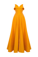 Moon Soleil Tangerine gown featuring flowing fabric and elegant design, perfect for formal occasions.