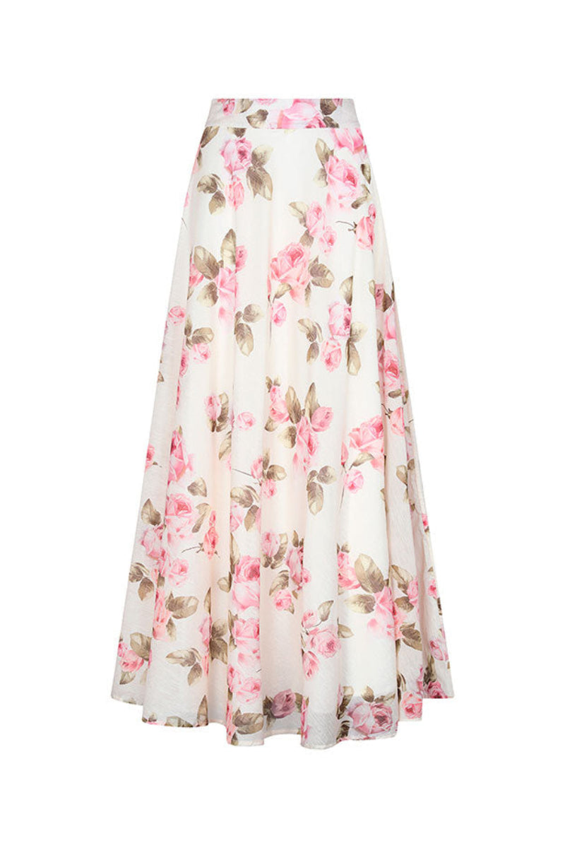 Aguaclara Rose Maxi Skirt with flowing fabric and floral pattern, displayed on a hanger against a neutral background.