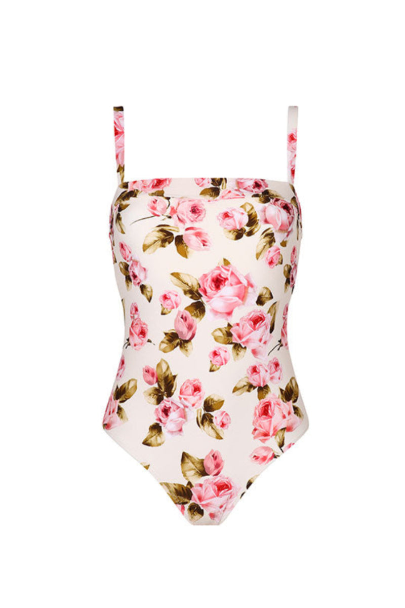 Aguaclara Rose One-Piece Swimsuit displayed on a model, featuring a stylish pink design and classic one-piece fit.