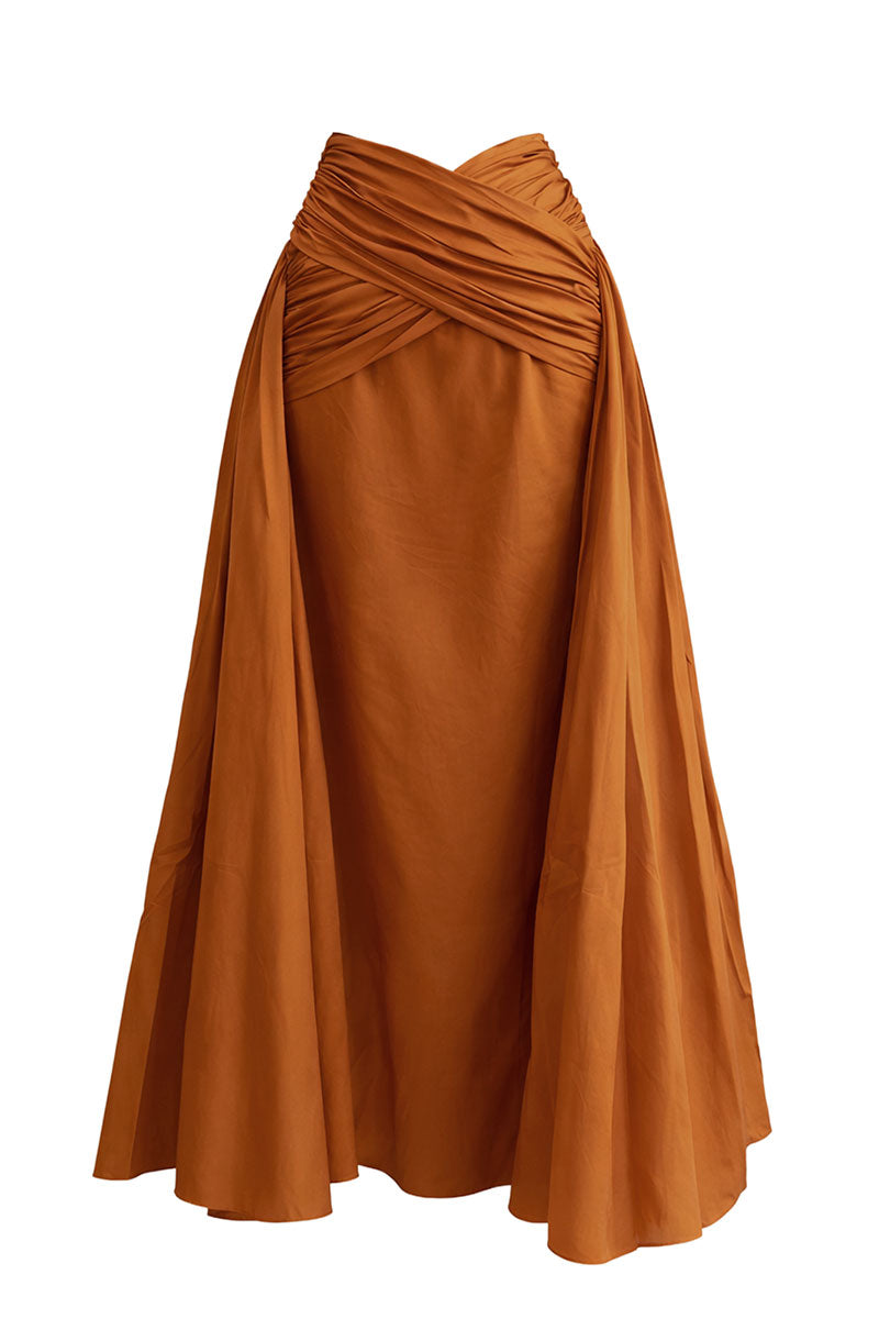 Andrea Iyamah GIA Maxi Skirt in burnt orange, flowing fabric, high-waisted design, and elegant length for versatile style.