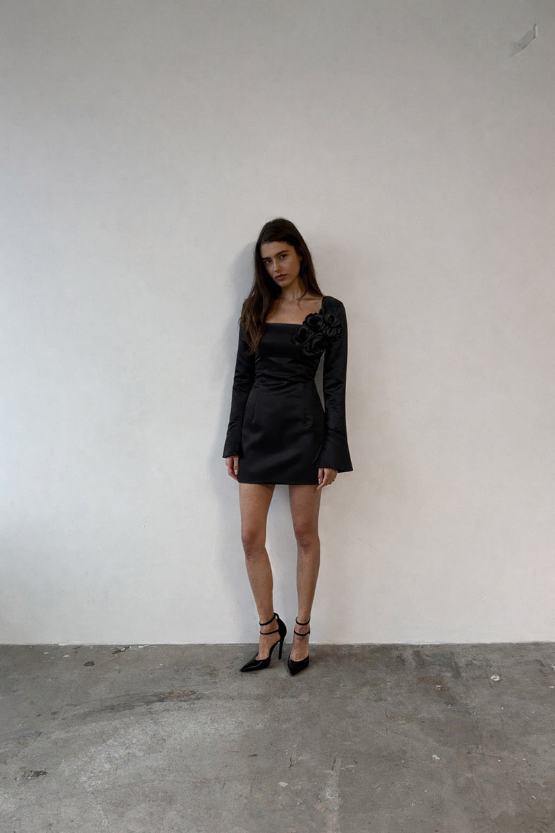 Black Gigi dress by Junie, stylish mini dress with fitted silhouette and sleeveless design, perfect for casual or evening wear.