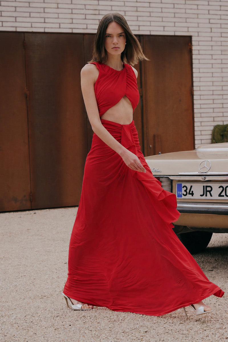 Red Gigii's Maja maxi dress with flowing fabric and sleeveless design, perfect for elegant summer occasions.