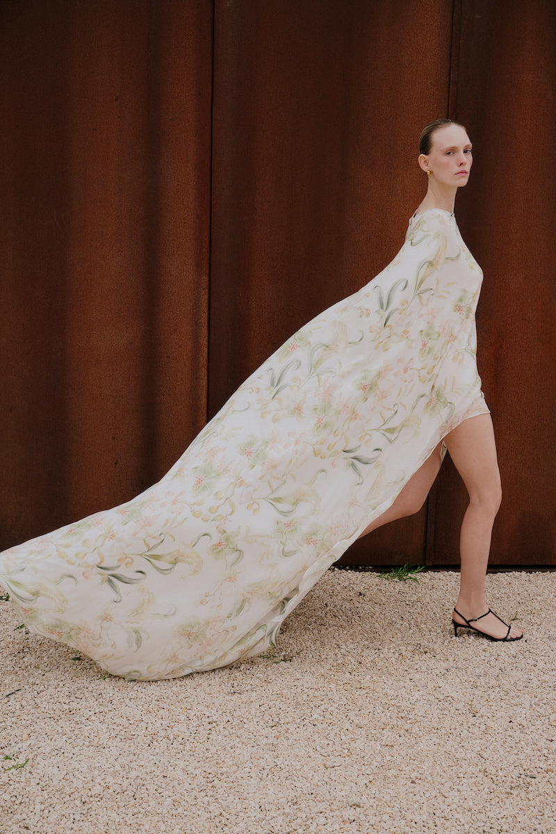 Floral ZETA maxi dress by Gigii's featuring a flowing fabric, vibrant floral pattern, and sleeveless design perfect for summer wear.