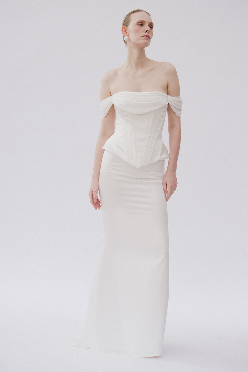 White Valentina co-ord top and skirt set by Gigii's, featuring a stylish matching crop top and high-waisted skirt.
