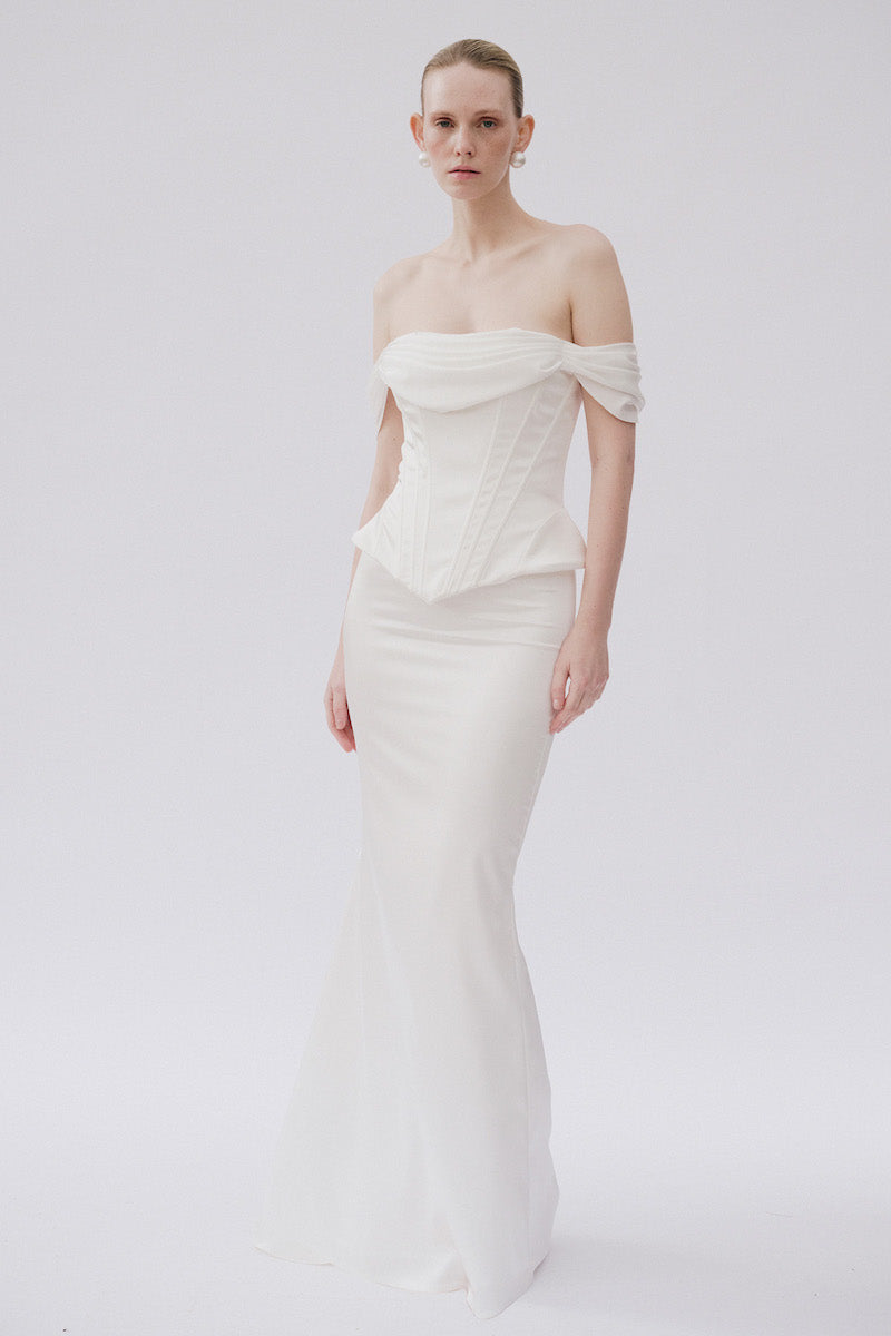 White Valentia co-ord top and skirt by Gigii's, featuring a stylish matching set with a fitted top and high-waisted skirt.