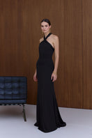 Elegant black GISEL halter neck long evening gown by UNDRESS, featuring a sleek design and flowing fabric.