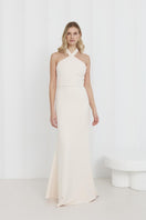 Undress GISEL cream off-shoulder long evening maxi dress displayed on a hanger. Elegant, flowing fabric for formal occasions.
