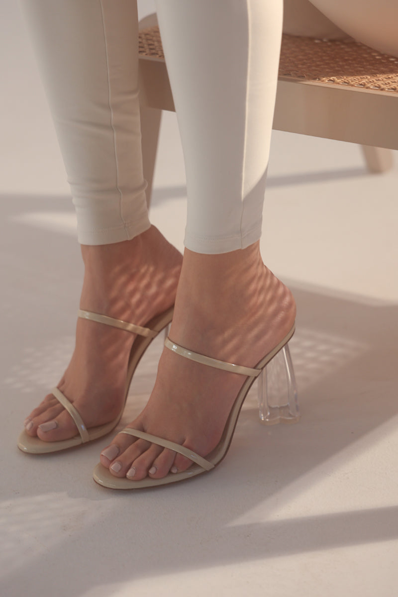 House of Atana Fiorellini Glass Mule 95 sandals in wheat patent with clear glass heel, beige color, stylish and elegant footwear.
