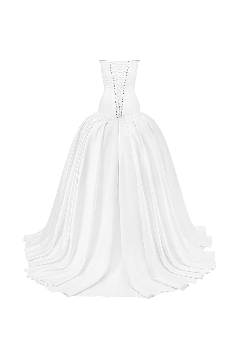 White cut-out silk gown by Phan Huy, showcasing a sleek design with elegant cut-outs and smooth fabric, front view.