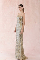 Gold strapless long gown by HACCHIC COUTURE featuring a flowing silhouette and elegant design, perfect for formal occasions.