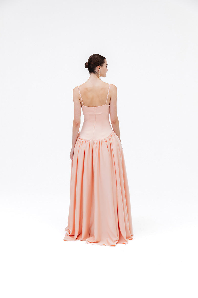 Studio NK peach maxi dress from the Grace collection, featuring flowing fabric and elegant design, perfect for summer wear.