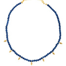 Navy blue Grappa necklace by PERACAS featuring a sleek, modern design with a stylish pendant on a matching chain.
