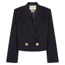 Black GURU crop blazer by Acaria Studio featuring a tailored fit and stylish design, shown on a model.