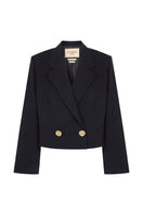 Black GURU crop blazer by Acaria Studio featuring a tailored fit and stylish design, shown on a model.