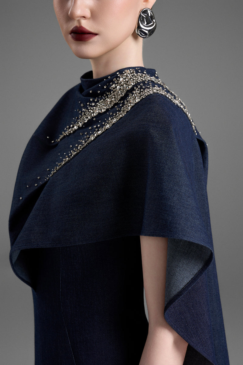 Dark blue GVLUX asymmetric draped shoulder A-line maxi dress, flowing fabric and elegant design, perfect for formal occasions.