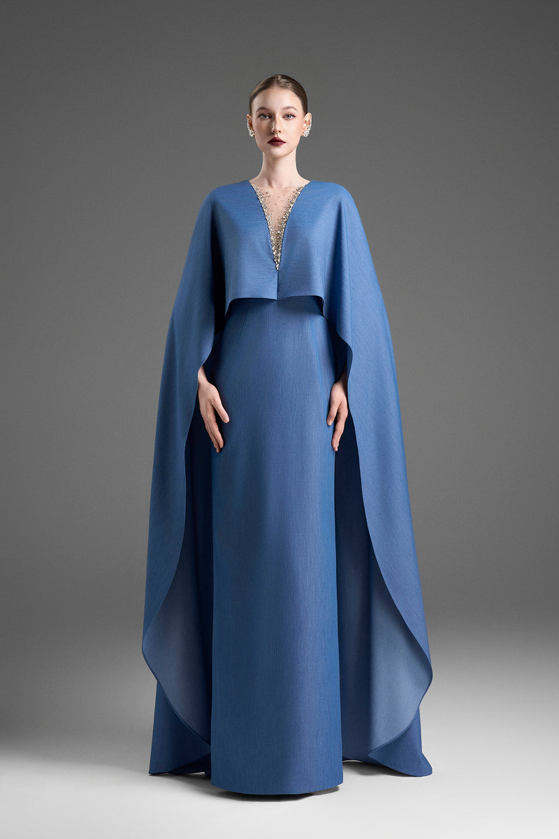 Blue V-neck kaftan gown with dolman sleeves by GVLUX, featuring elegant flowing fabric and a relaxed fit.