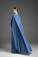 Blue V-neck kaftan gown with dolman sleeves by GVLUX, featuring an elegant and flowing design.