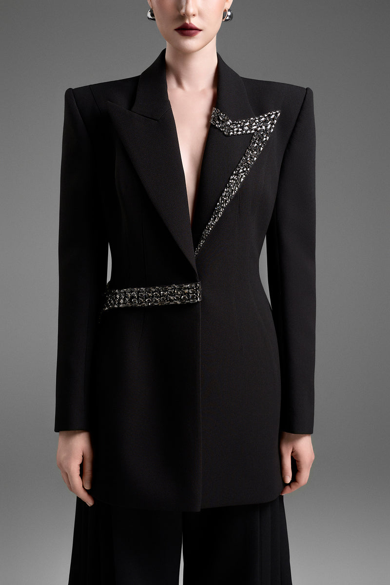Black tailored blazer vest with asymmetrical side-tie belt from GVLUX, featuring a sophisticated, modern design.