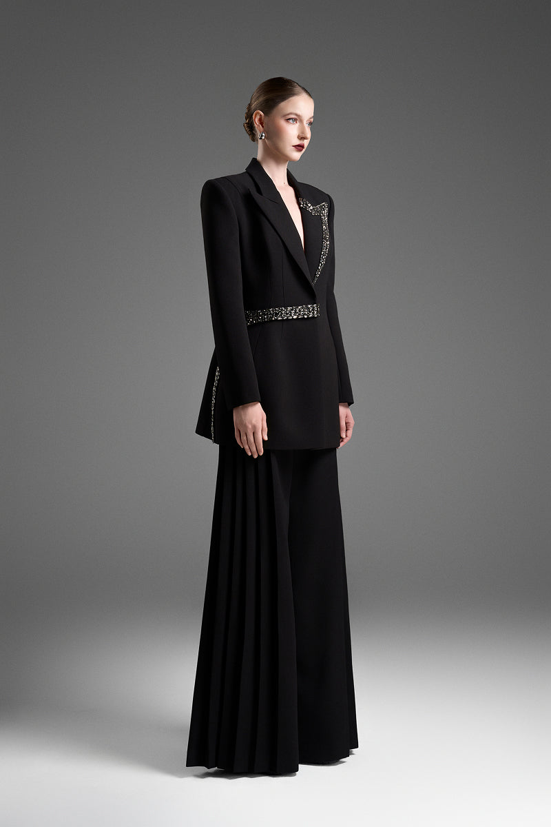 Black tailored blazer with asymmetrical side-tie belt from GVLUX, featuring a sleek, structured design for a modern, stylish look.