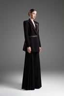 Black tailored blazer vest with asymmetrical side-tie belt from GVLUX, featuring sleek design and structured fit.