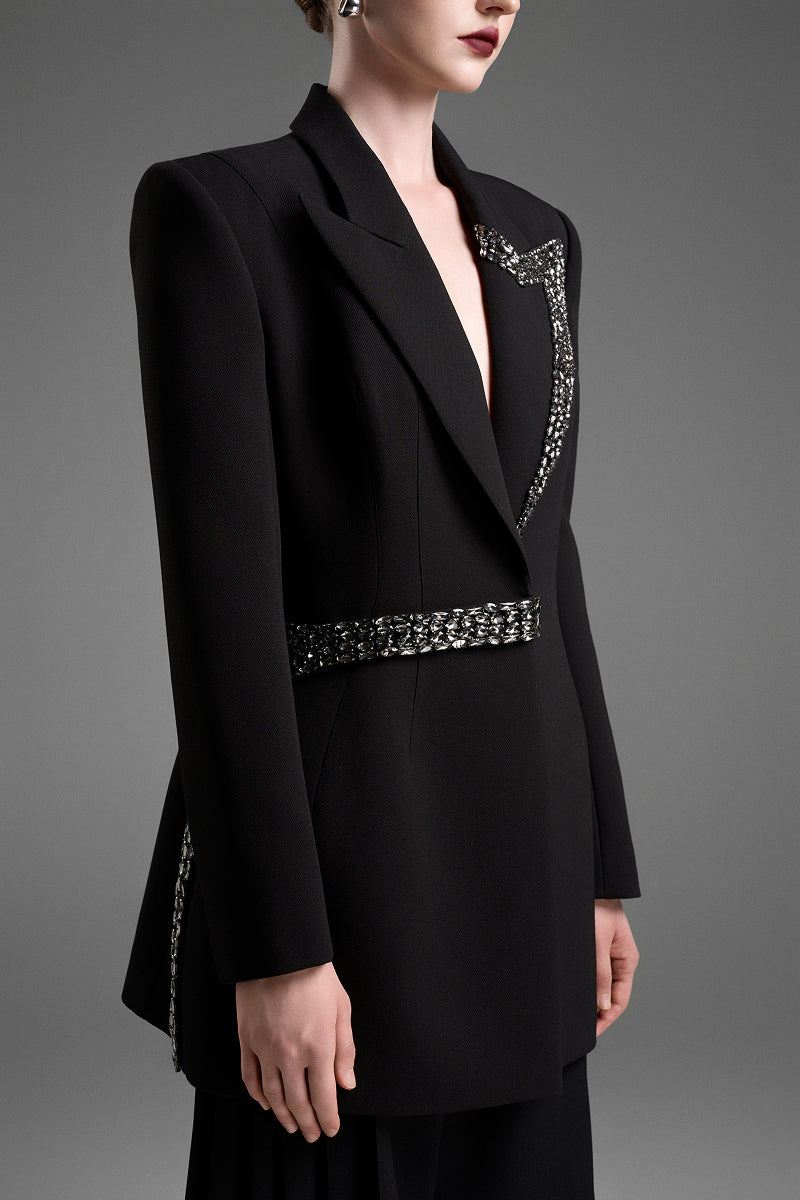 Black tailored blazer vest with asymmetrical side-tie belt from GVLUX, featuring a sleek, modern design and fitted silhouette.