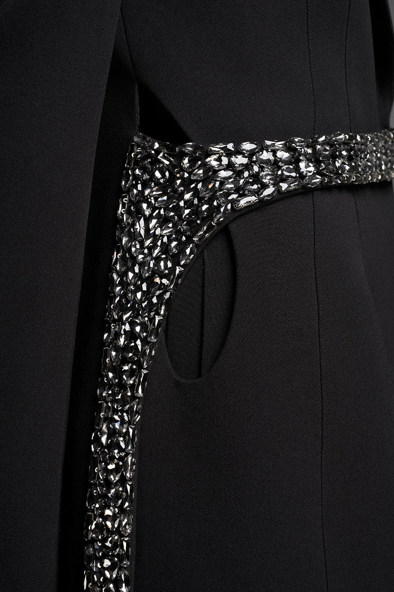Black tailored blazer vest with asymmetrical side-tie belt by GVLUX, featuring a structured fit and sleek design.