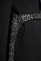 Black tailored blazer with asymmetrical side-tie belt by GVLUX, featuring structured design and sleek fit.