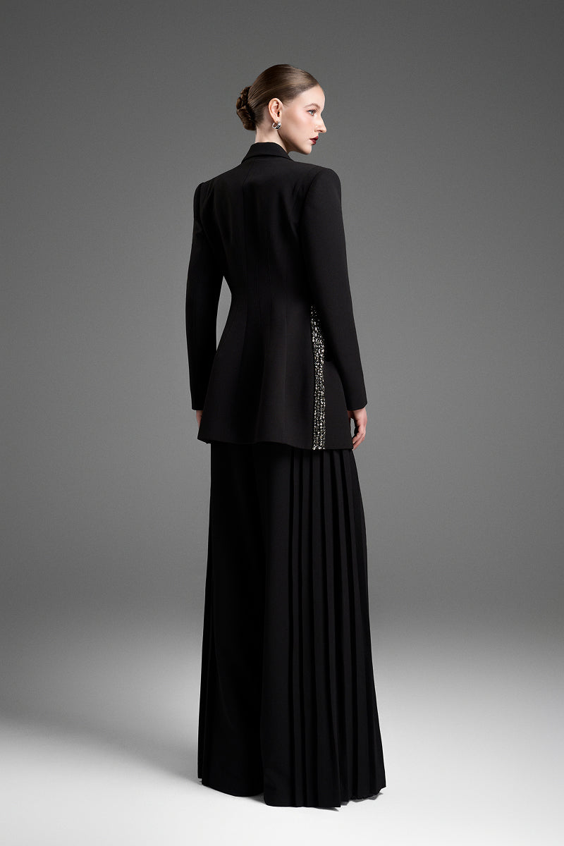 Black tailored blazer vest with an asymmetrical side-tie belt by GVLUX, stylish and modern fashion piece.