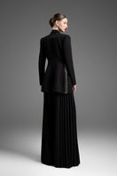 Black tailored blazer vest with asymmetrical side-tie belt by GVLUX, featuring sleek, structured design and modern fashion details.