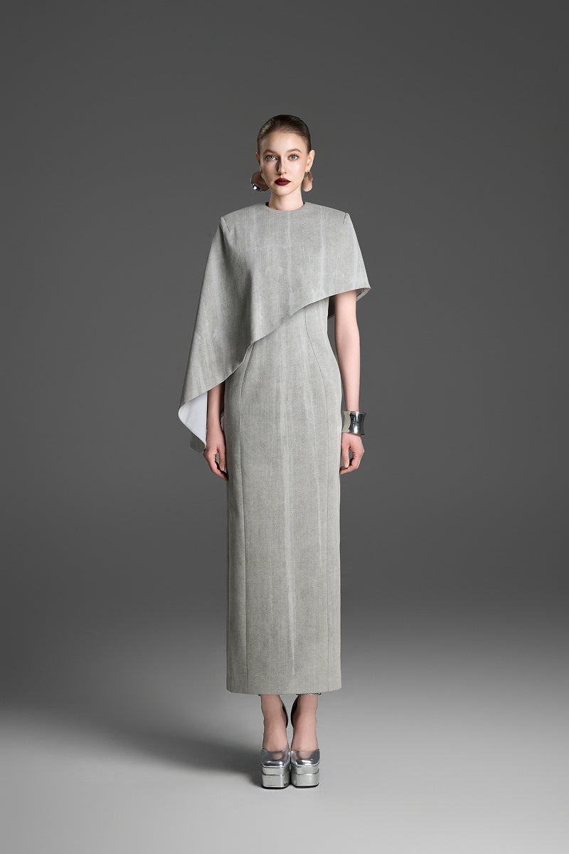 Light gray GVLUX asymmetric draped cape sleeve maxi dress showcasing elegant, flowing design and sophisticated style.