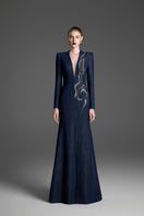 Dark blue V-neck mermaid gown with crystal embellishments by GVLUX, showcasing a fitted silhouette and elegant design.