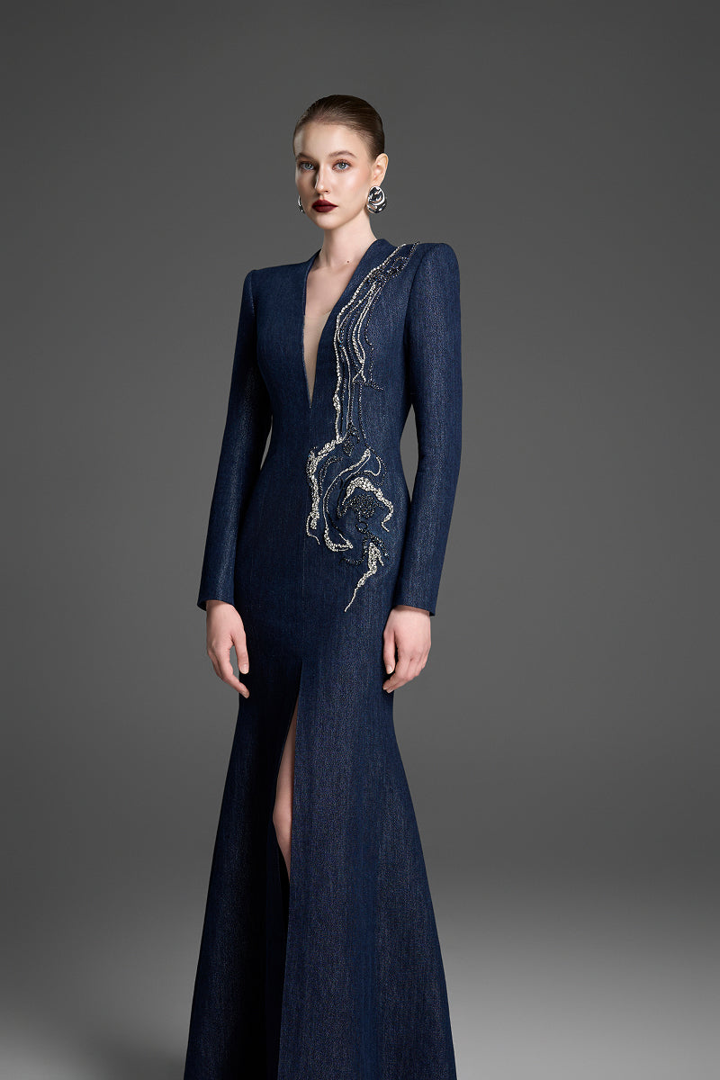 Dark blue V-neck mermaid maxi gown by GVLUX with crystal embellishments, fitted silhouette, and flowing fabric.