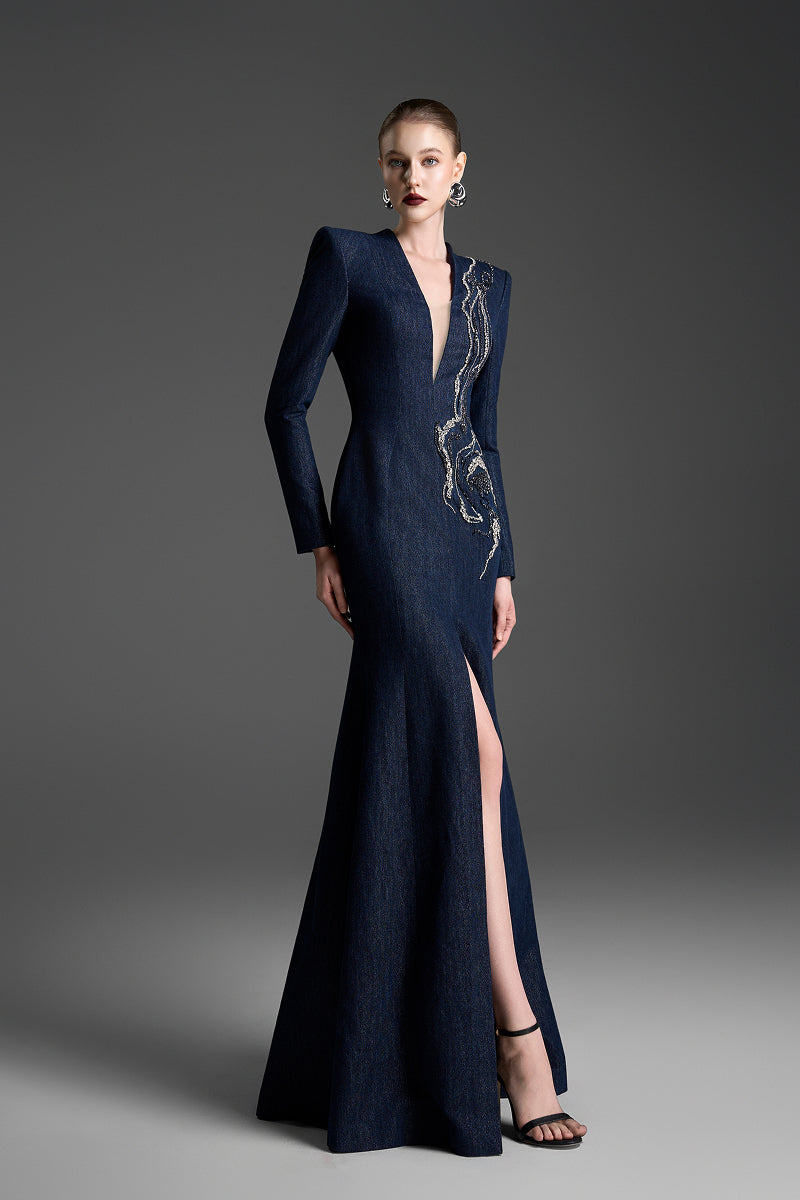 Dark blue V-neck mermaid gown with crystal embellishments by GVLUX, featuring a fitted silhouette and flowing maxi dress design.