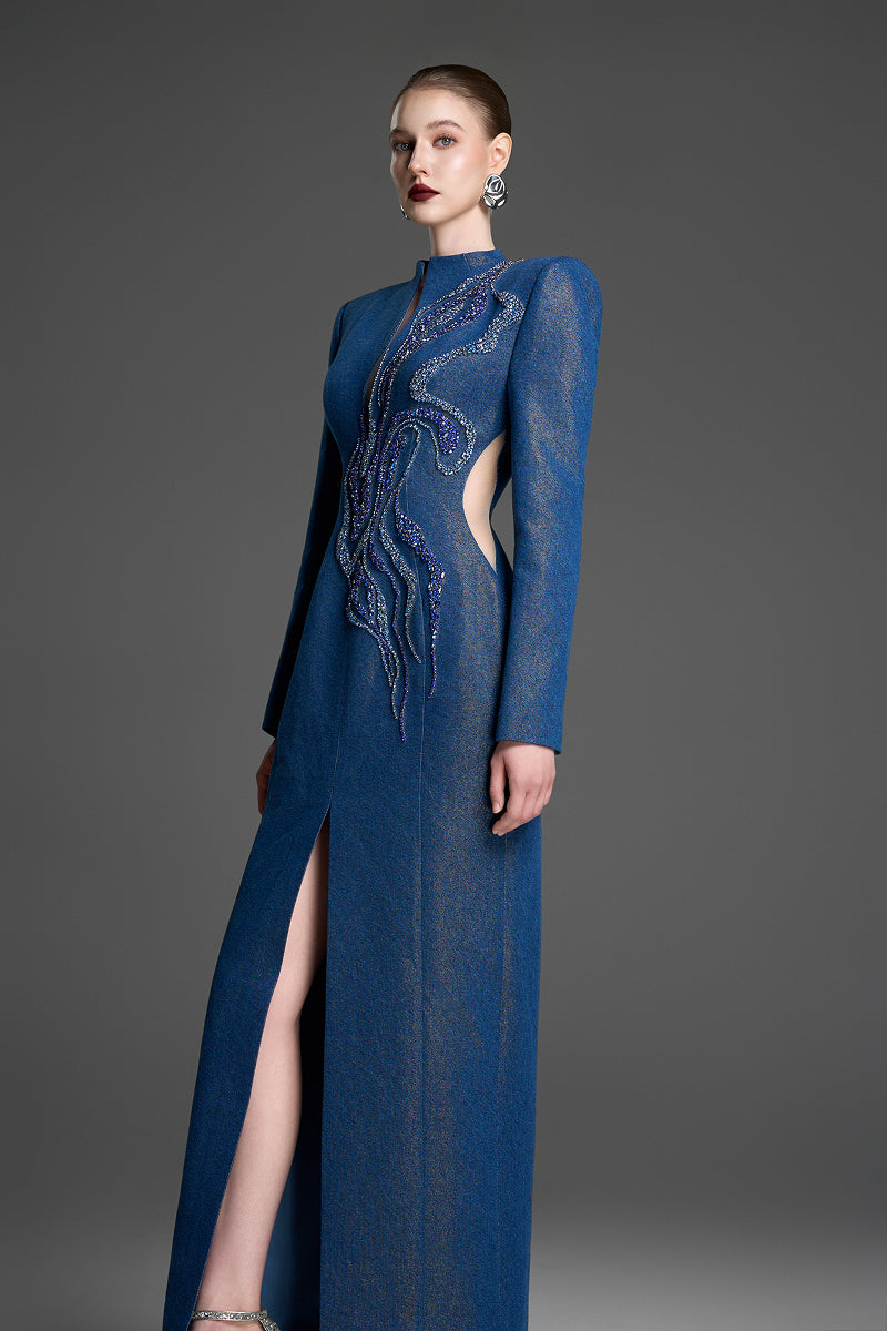 Blue column gown with crystal embroidery by GVLUX, featuring elegant fitted silhouette and intricate beadwork.