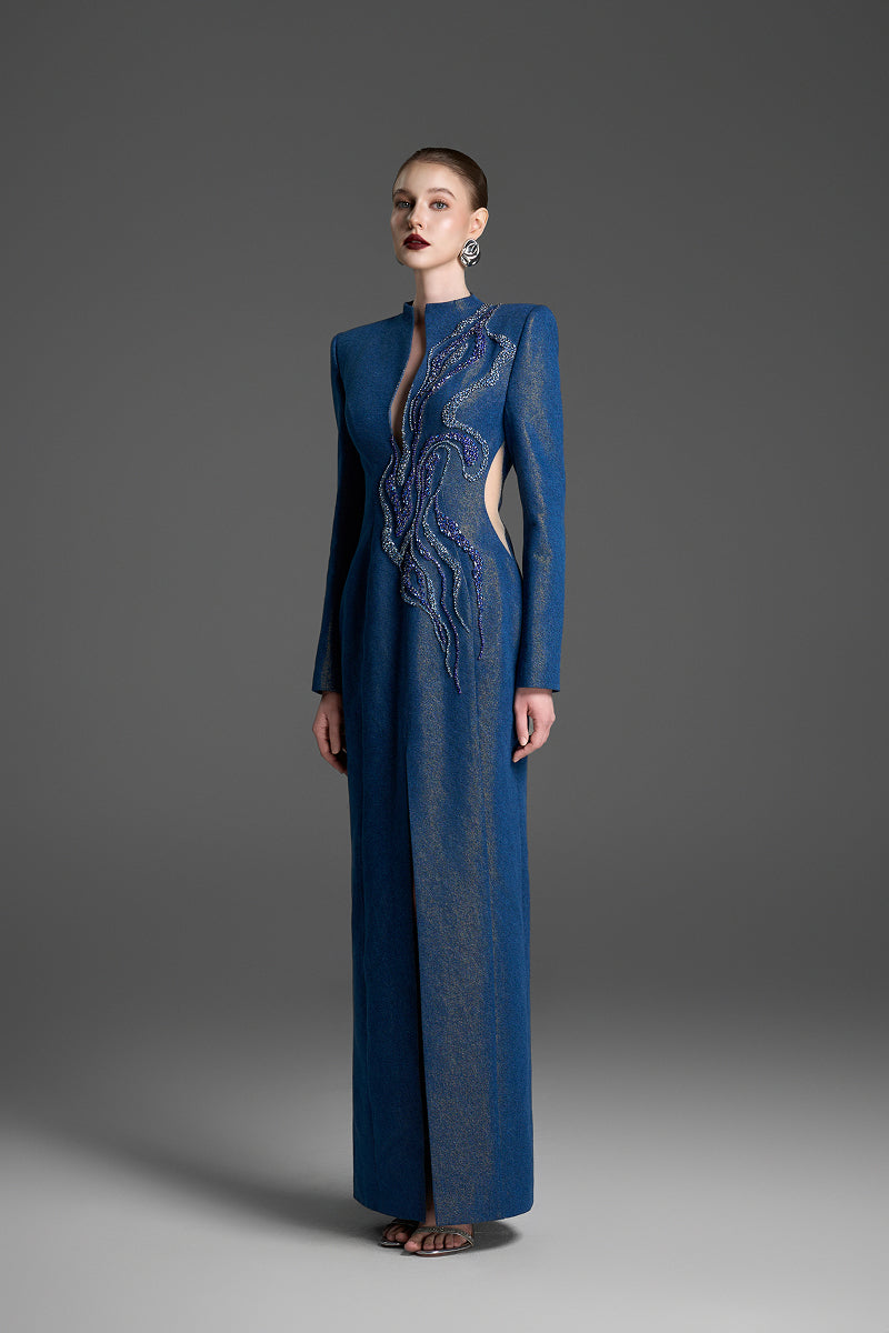 Blue column gown with intricate crystal embroidery by GVLUX, showcasing elegant fabric and detailed embellishments.