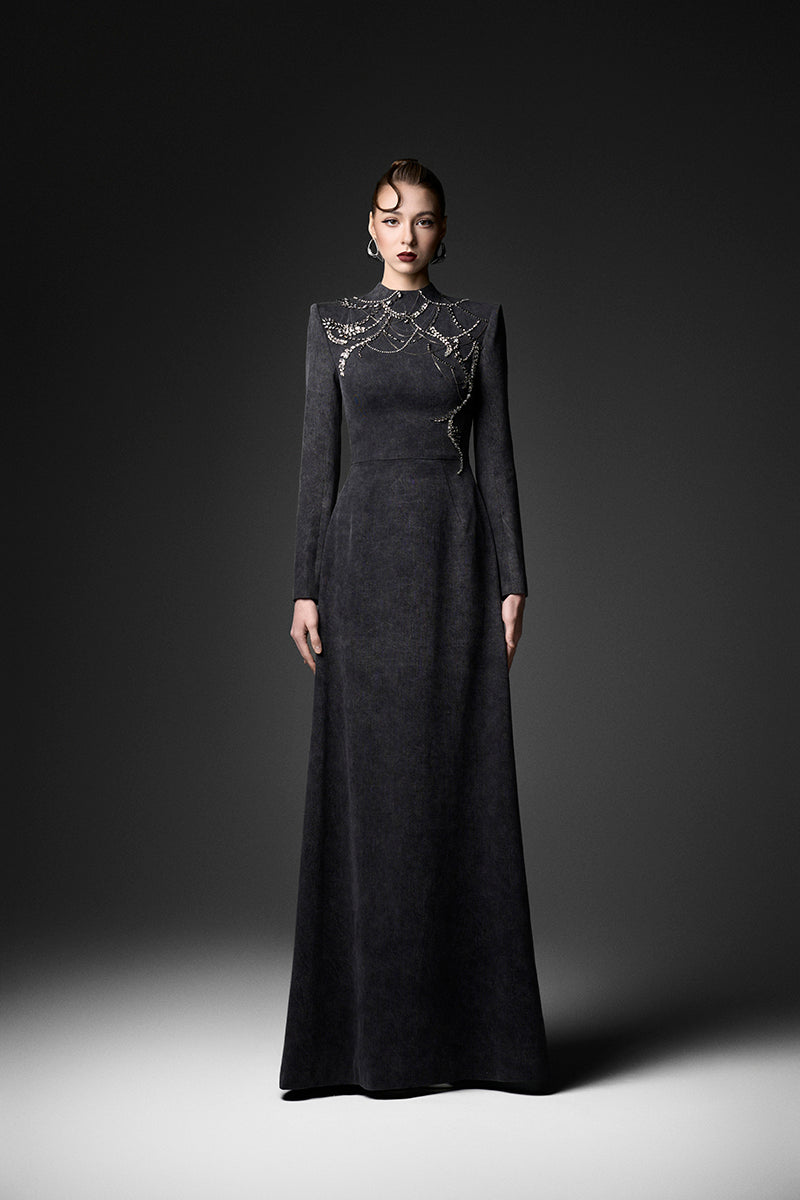 Elegant midnight fireworks long sleeve gown by GVLUX, featuring a flowing design and intricate details perfect for formal occasions.