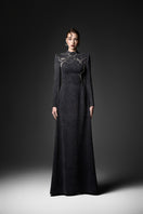 Elegant midnight fireworks long sleeve gown by GVLUX, featuring a flowing design and intricate details perfect for formal occasions.
